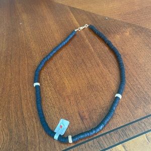 black clay beaded bracelet with small smooth wood charms